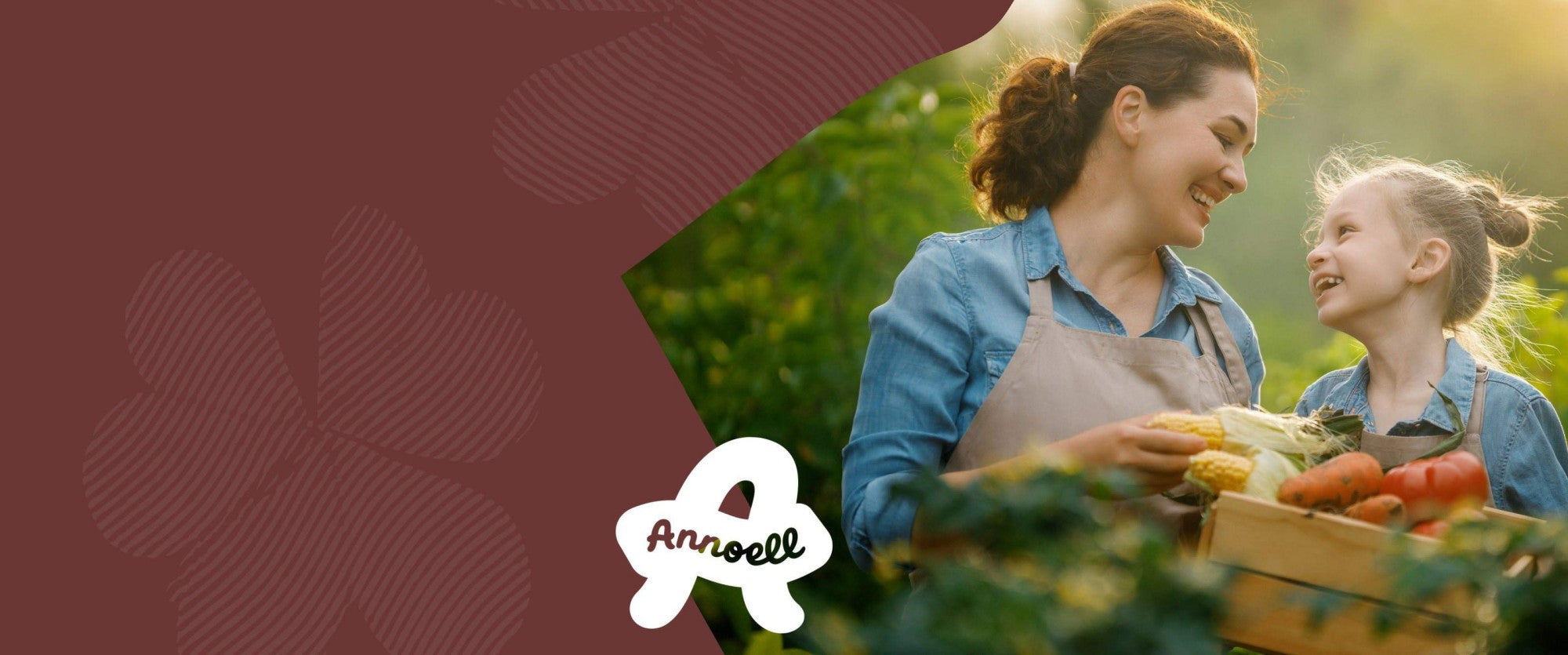 Woman and child with a box of vegetables in a garden, Annoell logo visible